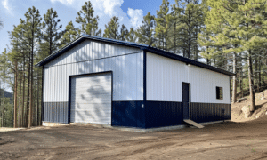 White and navy blue metal building in Ontario with modern design and industrial features, suitable for commercial use.